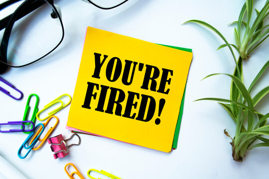 Text sign showing YOU'RE FIRED