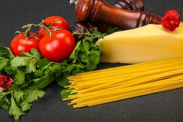 Raw Italian spaghetti heap with cheese