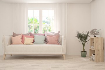 Minimalist living room in white color with sofa and summer landscape in window. Scandinavian interior design. 3D illustration