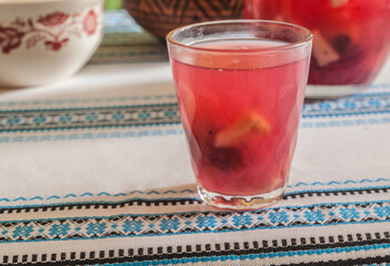 Glass with compote on the table