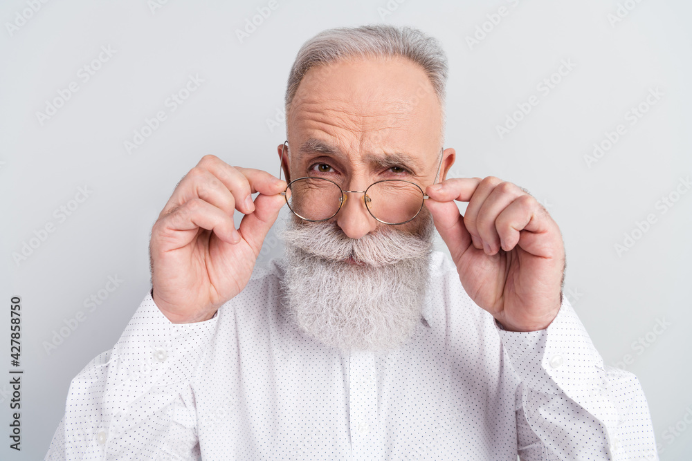 Sticker photo of suspicious serious old man wear glasses interested wear shirt isolated on grey color backgr