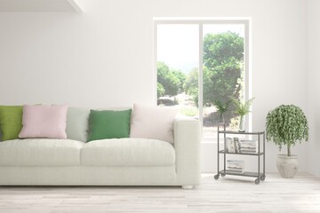White living room with sofa and summer landscape in window. Scandinavian interior design. 3D illustration