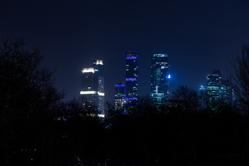 night metropolis, top view, high-rise office buildings against a dark sky, modern office buildings in the financial district