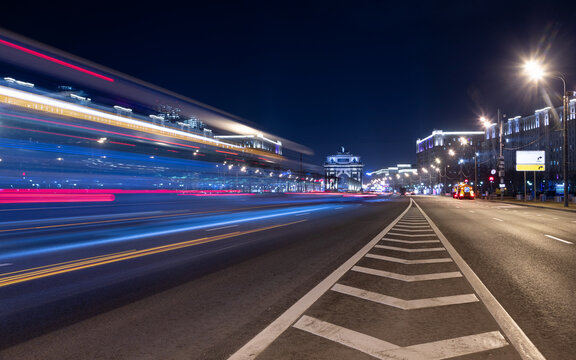 Long exposure shot of a busy street at night creating dynamic effect of the vehicle lights.
