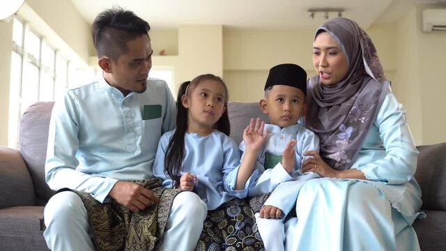 Eid Mubarak celebration moment, Malay family