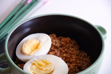 Buckwheat porridge with egg. Food.
