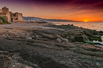 Fototapeta na wymiar Amanecer junto al castillo de Santa Ana en Roquetas de mar