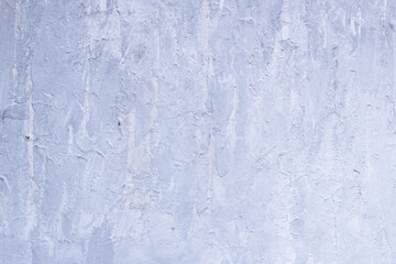 Grey painted background with a rough texture