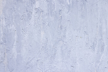 Grey painted background with a rough texture