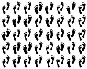 Black prints of bare foot on a white background