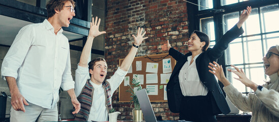 Office team celebrating successful goals