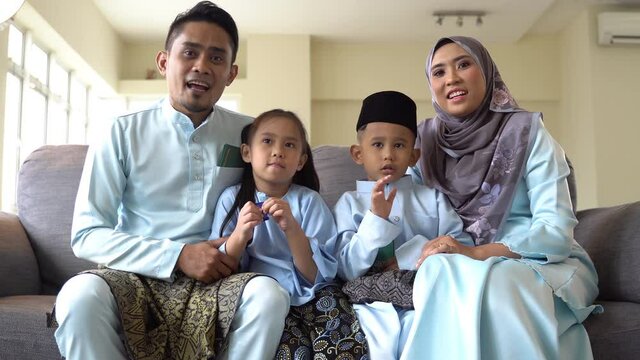 Eid Mubarak celebration moment, Malay family