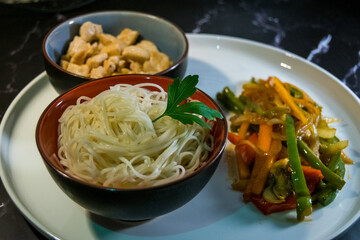 noodles with chicken and fried vegetables