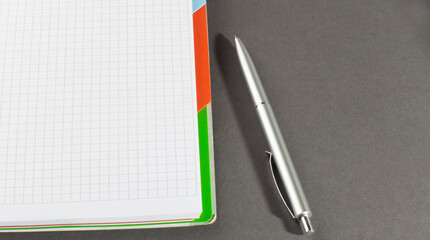 blank white notebook on the gray background