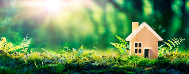 Fototapeta Eco House In Green Environment - Wooden Home Friendly On Grass obraz