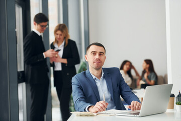 Group of people in official formal clothes that is indoors in the office