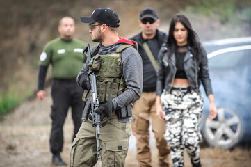 Fototapeta na wymiar Bodyguard and VIP people security protection. Combat gun shooting training on outdoor shooting range