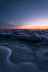 Sunset among the ice hummocks in the Kandalaksha Bay of the White Sea