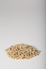 Sunflower seeds are cleaned. Peeled sunflower seeds on a white background.