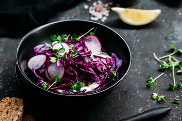 Purple cabbage salad with radish and cucumber
