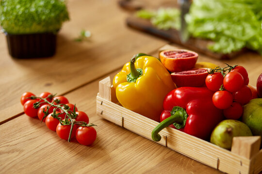 Wooden box with natural fresh vegetables and fruits  for cooking. Bio organic food, healthy eating, Shopping, grocery store.  Diet and vegetarian concept.