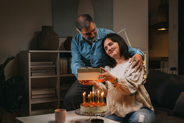 middle age couple celebrating anniversary at home