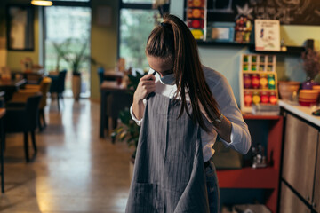 waitress get dressed for work at restaurant