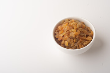 Raisins on white background, Isolated Raisin, Heap of yellow Raisins.