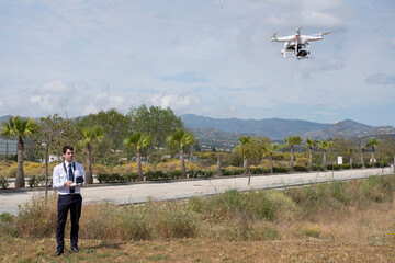 Young student during a drone flight practice in an aviation school