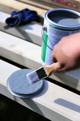 hand with paint brush