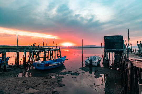 Sunset at the Carrasqueira Palafitic pier in Comporta, Portugal