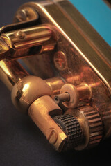 Macro shot of a lighter, parts devices, wheels for extracting sparks and holes in places of fire. Close-up. View from above. High quality photo