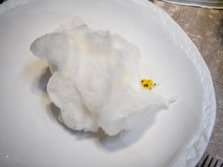 Grilled sweet corn and vanilla ice cream decorated on white dish, selective focus