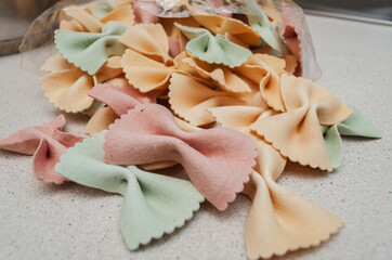colored pasta in the form of bows