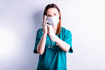 Surgeon doctor putting on gloves for an operation. medicine concept on white background