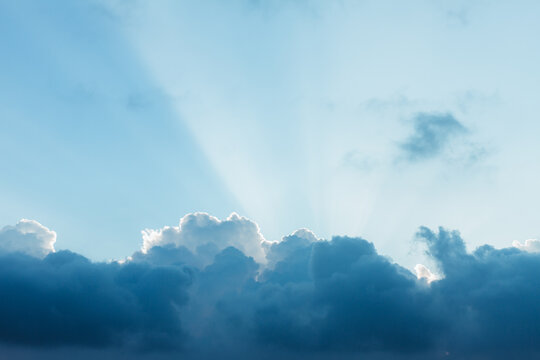 Shine flares behind the clouds