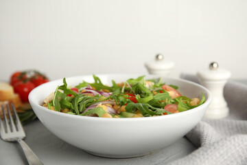 Delicious fresh chickpea salad on light grey table