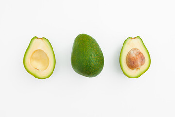 Avocado fruit whole and half on white. Natural food concept.
