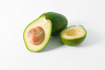 Avocado fruit whole and half on white. Natural food concept.