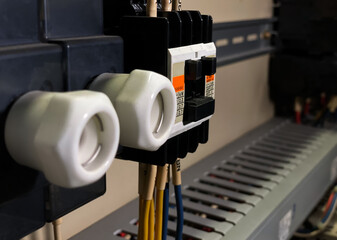 Side view and low light. Magnetic Contactor of Main line connection point to the circuit board. And...