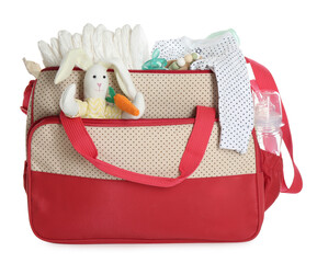 Mother's bag with baby's stuff isolated on white