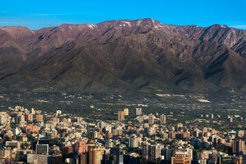 The Andes Mountain Range with buildings of the wealthy district of Providencia in Santiago de Chile.