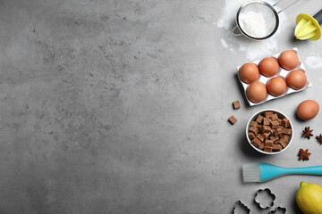 Cooking utensils and ingredients on grey table, flat lay. Space for text