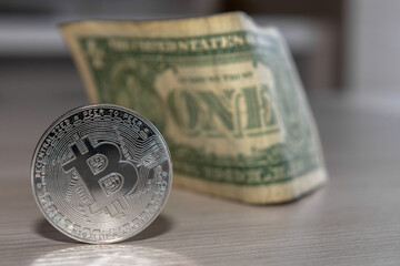 bitcoin coin on a dollar background