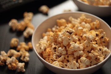 two plates of popcorn on the table