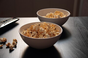 two plates of popcorn on the table