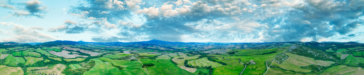 Fototapeta na wymiar Aerial view of Tuscany Hills in spring season from drone at sunset