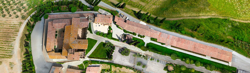 Aerial view of Banfi Castle from drone in Tuscany, spring season