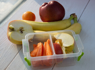 Lunch box with vegetables and fruits. Healthy food concept. Back to school. Top view