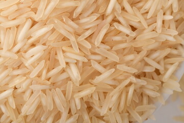 Pile of brown rice isolated on white background.